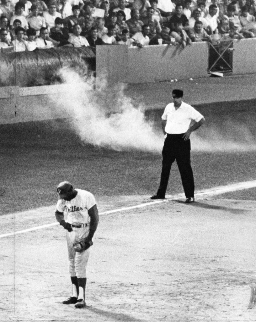 Smoke bombs being tossed onto the field near Dick Allen / George D. McDowell Philadelphia Evening Bulletin Collection, Special Collections Research Center, Temple University Libraries, Philadelphia, PA